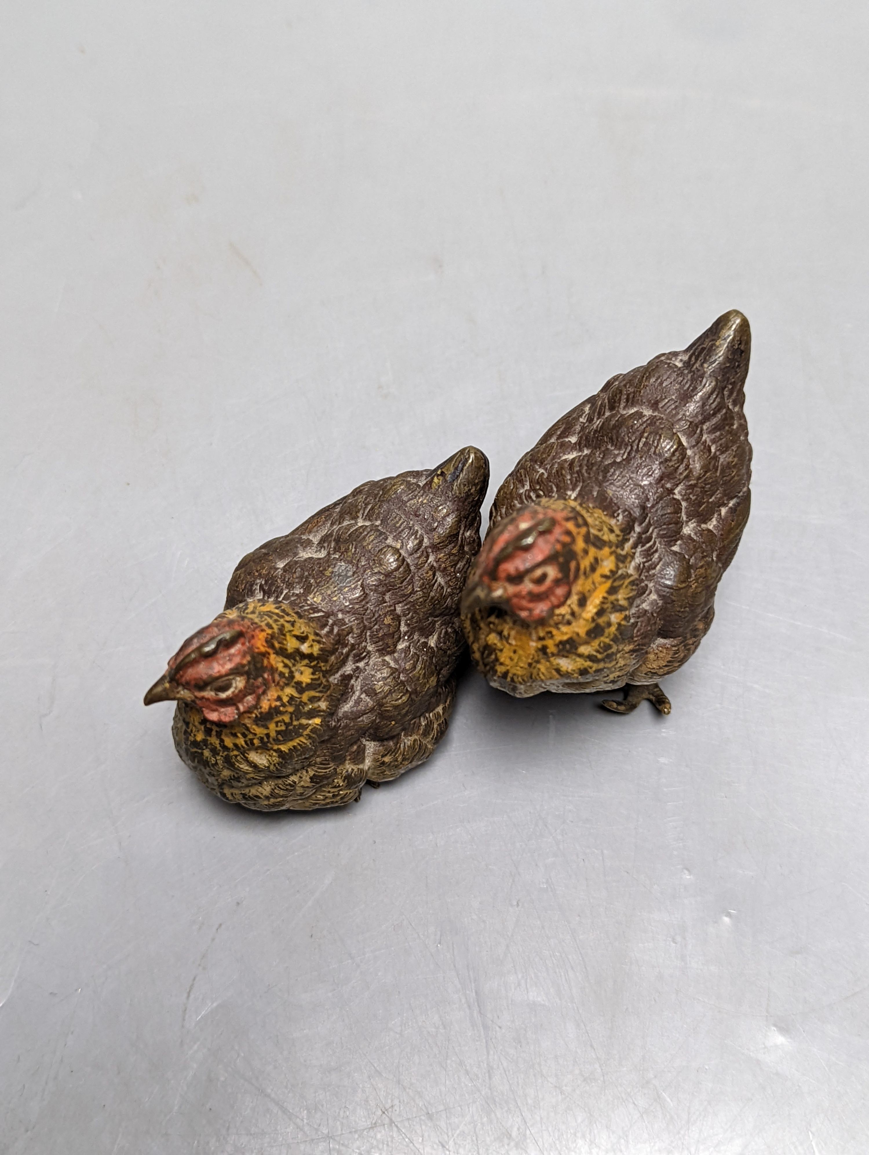 A pair of late 19th century cold painted bronze models of a cock and hen, 66mm